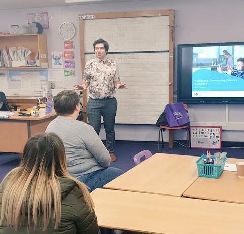 National Numeracy's Ben delivering a workshop to parents at the front of a classroom