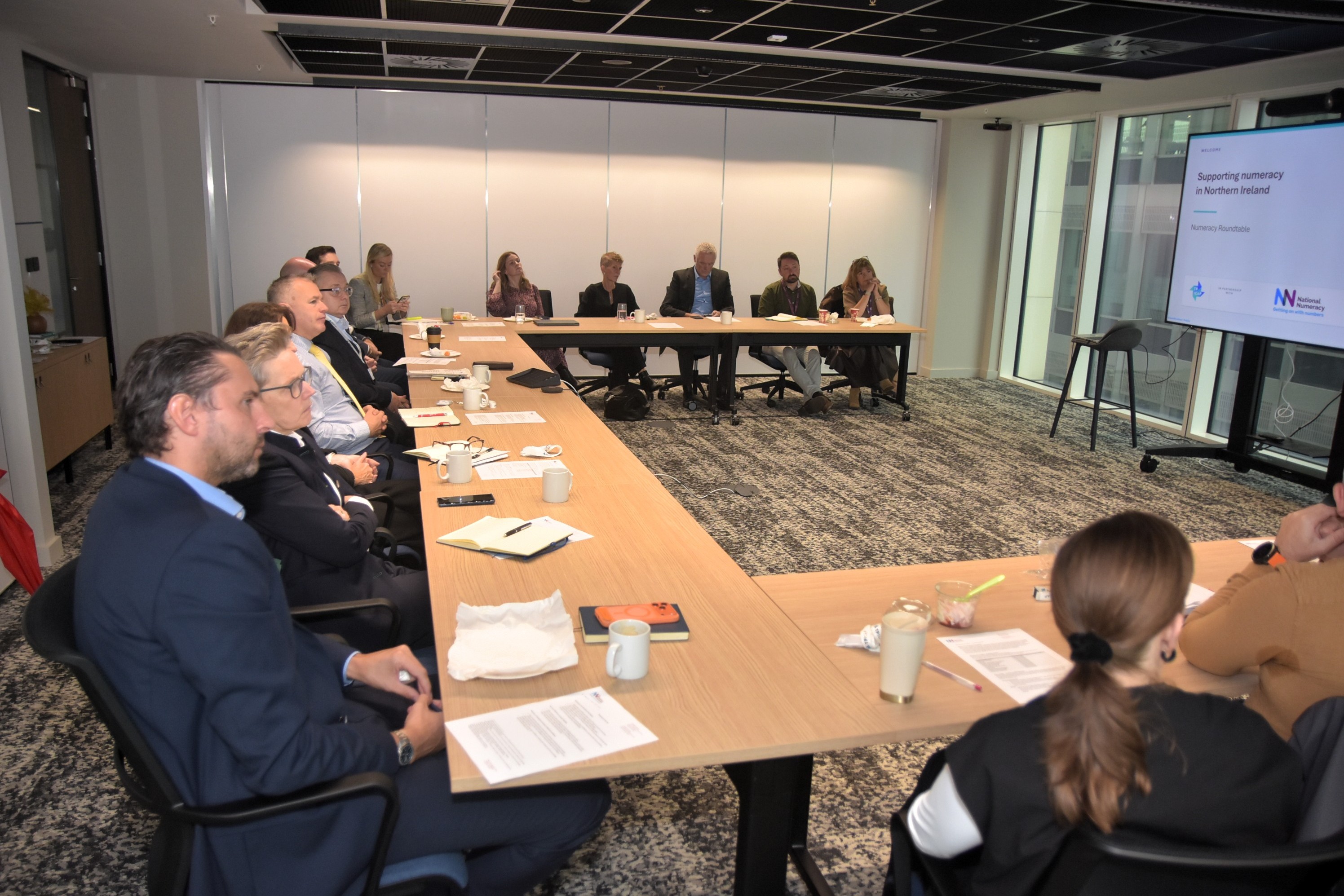 Attendees at a TP ICAP business breakfast, sitting around a table