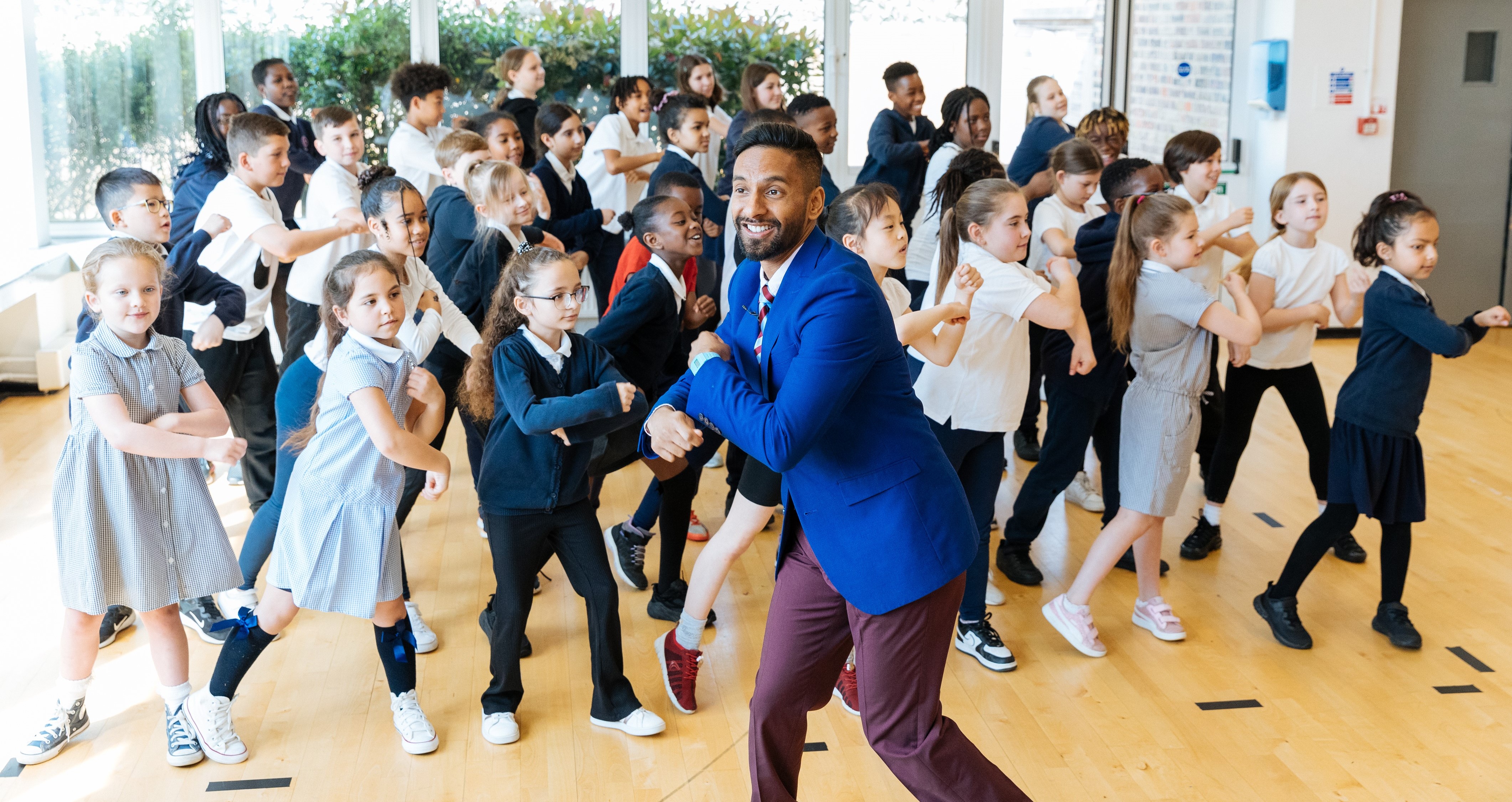 Bobby Seagull dancing with schoolchildren as part of National Numeracy Day LIVE in 2023