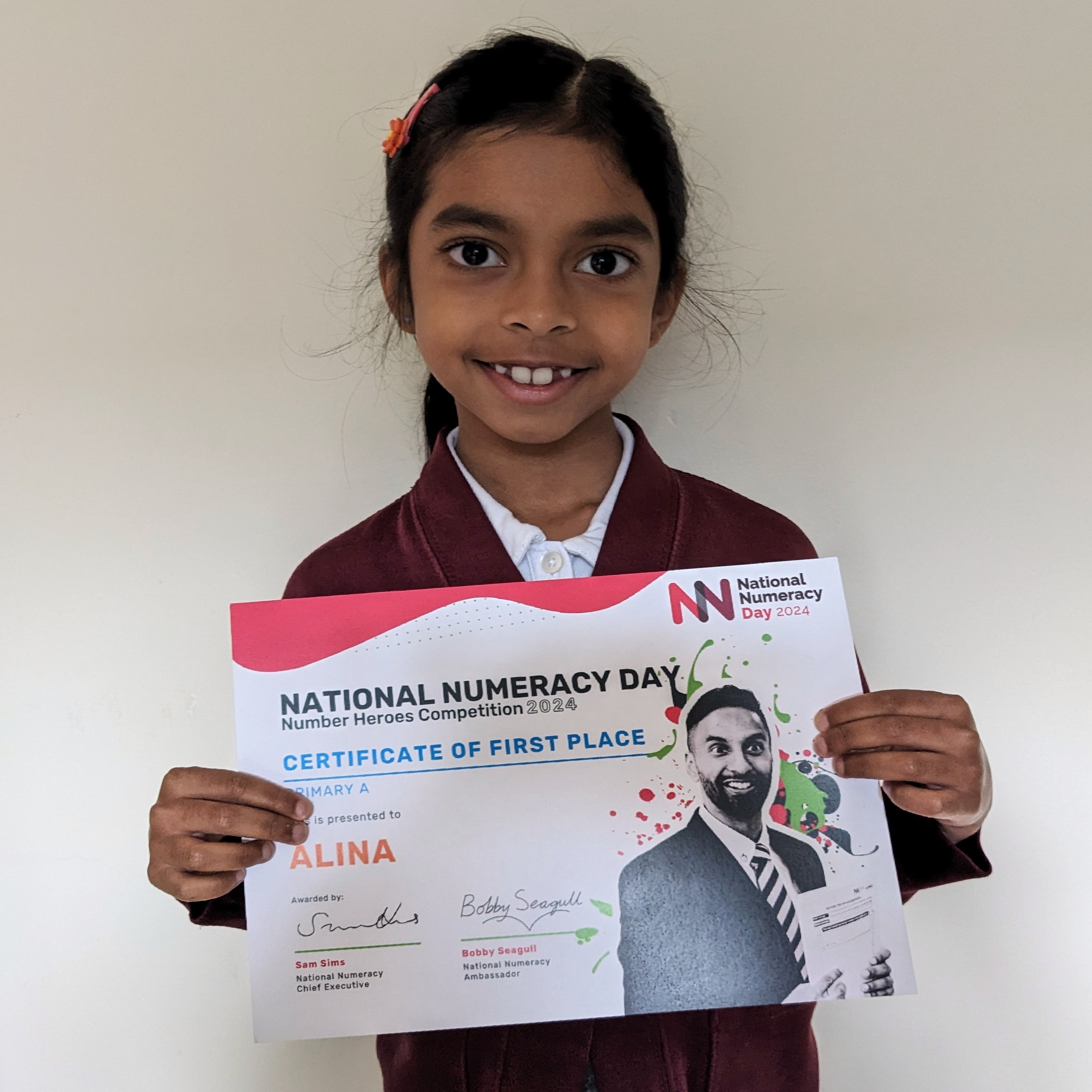 Competition winner Alina with her certificate