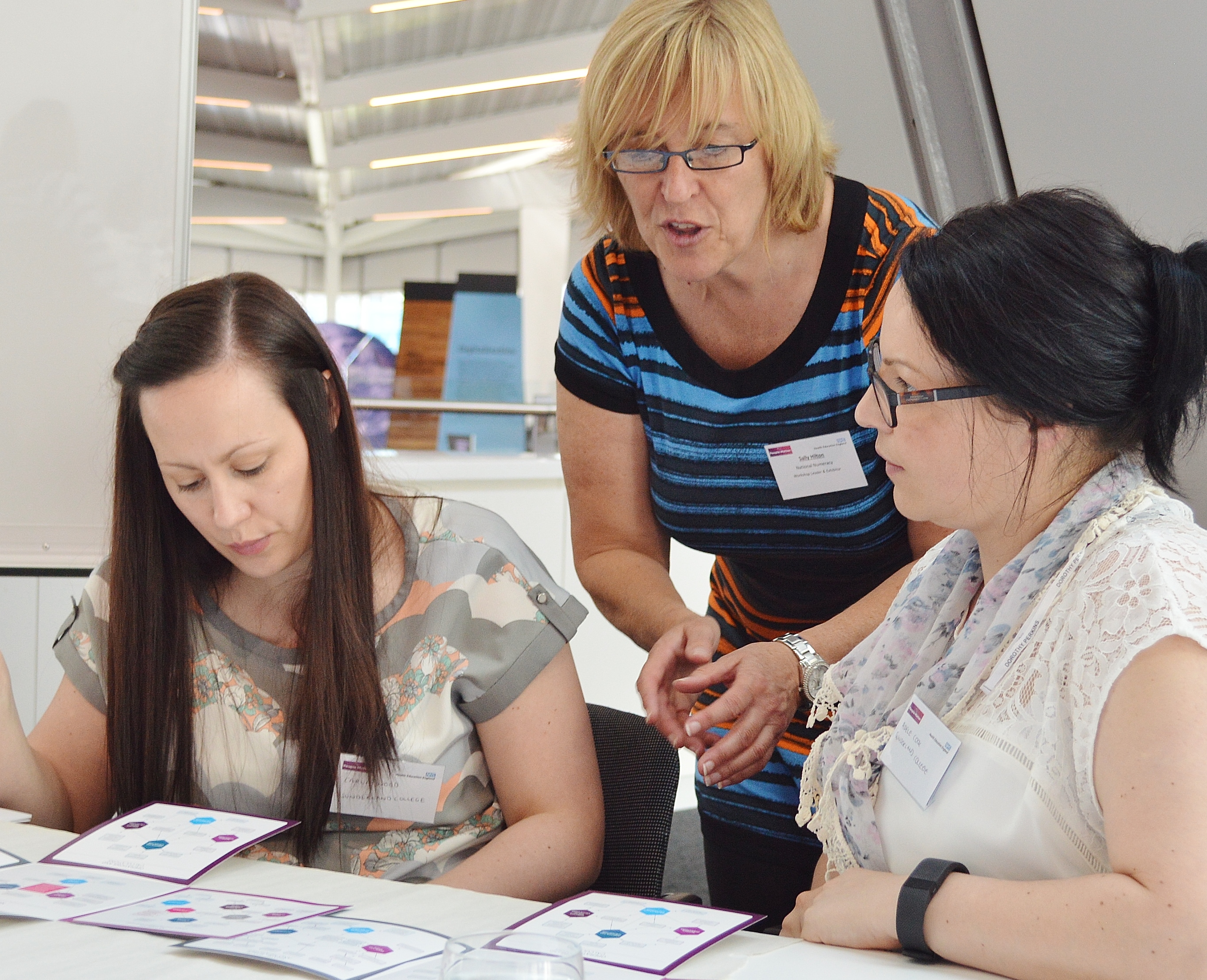 National Numeracy's National Relationships Manager Sally working with two female champions