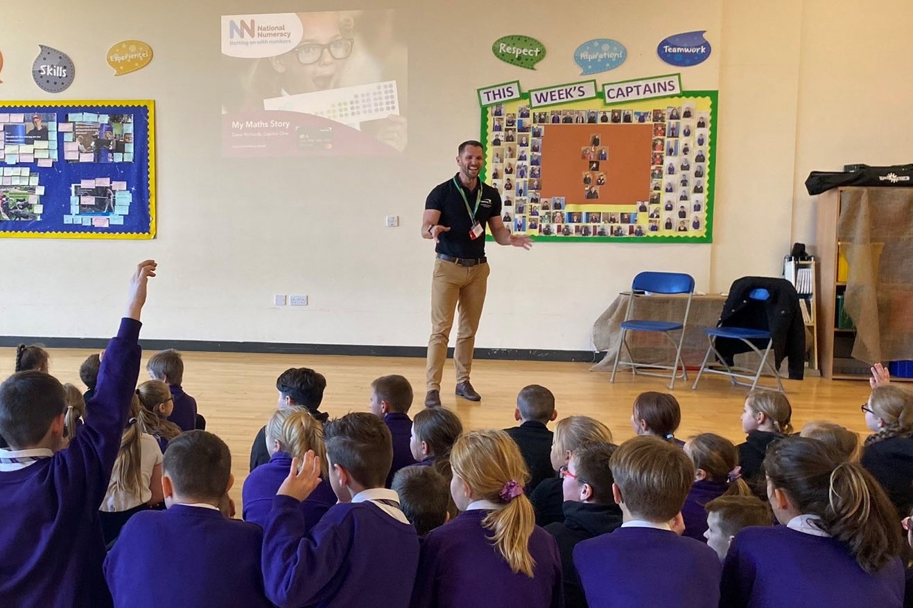 Volunteer leading an assembly