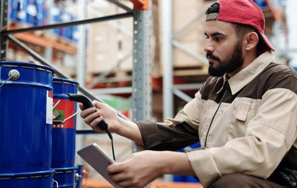 Person scanning item in a warehouse