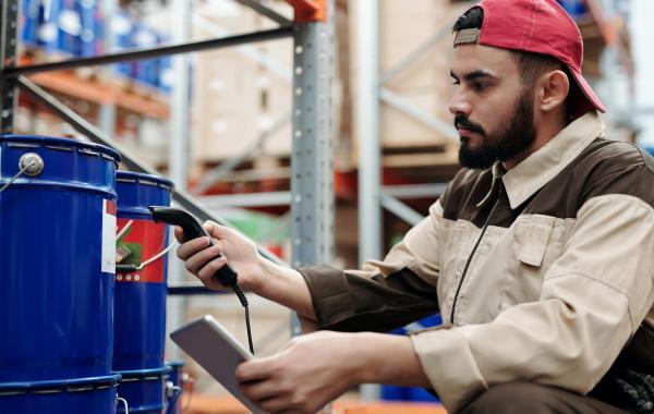 Person scanning item in a warehouse