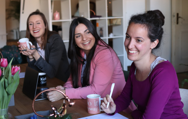 Image of women sat around table