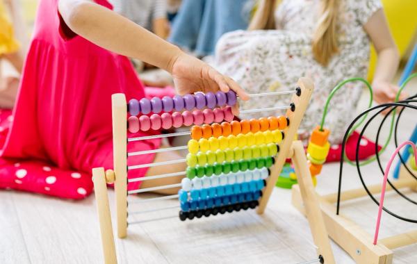 child playing with abacus