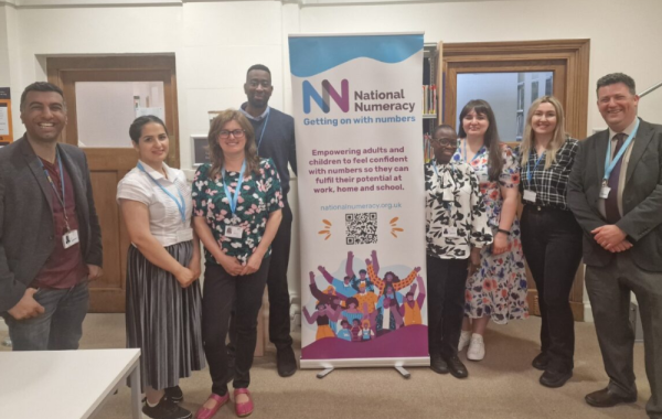 Capital City College Group staff with National Numeracy banner