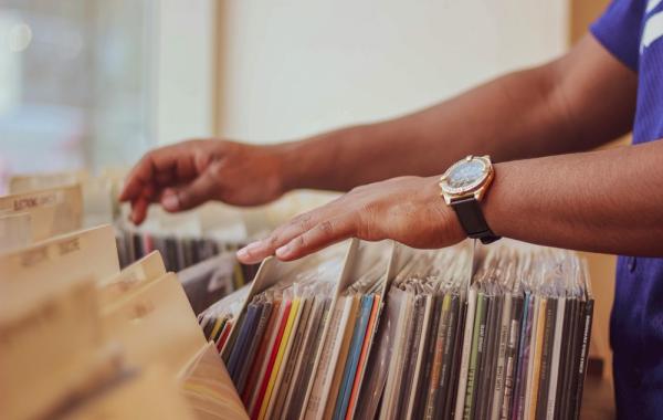 Someone looking through a record collection