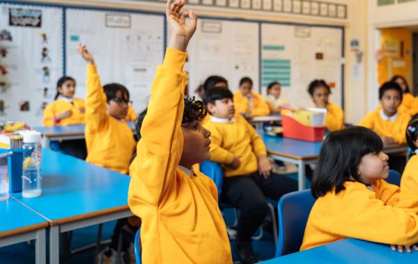Children putting hands up