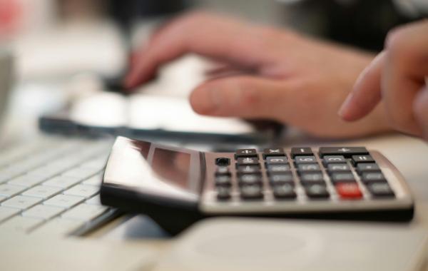 A person using a calculator