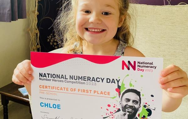 One of the 2023 winners, Chloe, with her certificate
