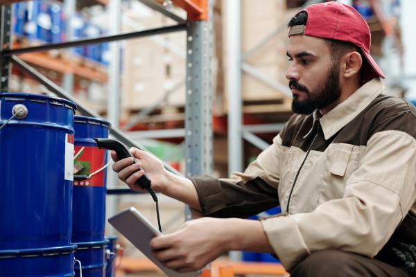 Person scanning item in a warehouse