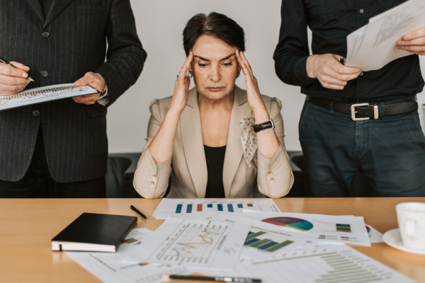 Person looking stressed when faced with graphs and data