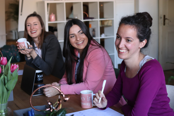 Image of women sat around table