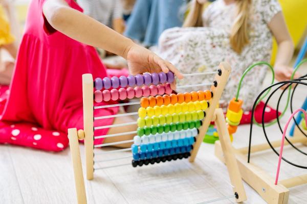 child playing with abacus