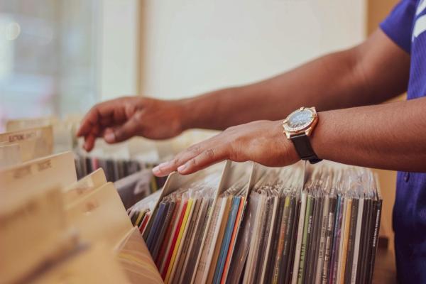 Someone looking through a record collection