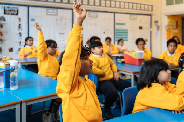 Children putting hands up